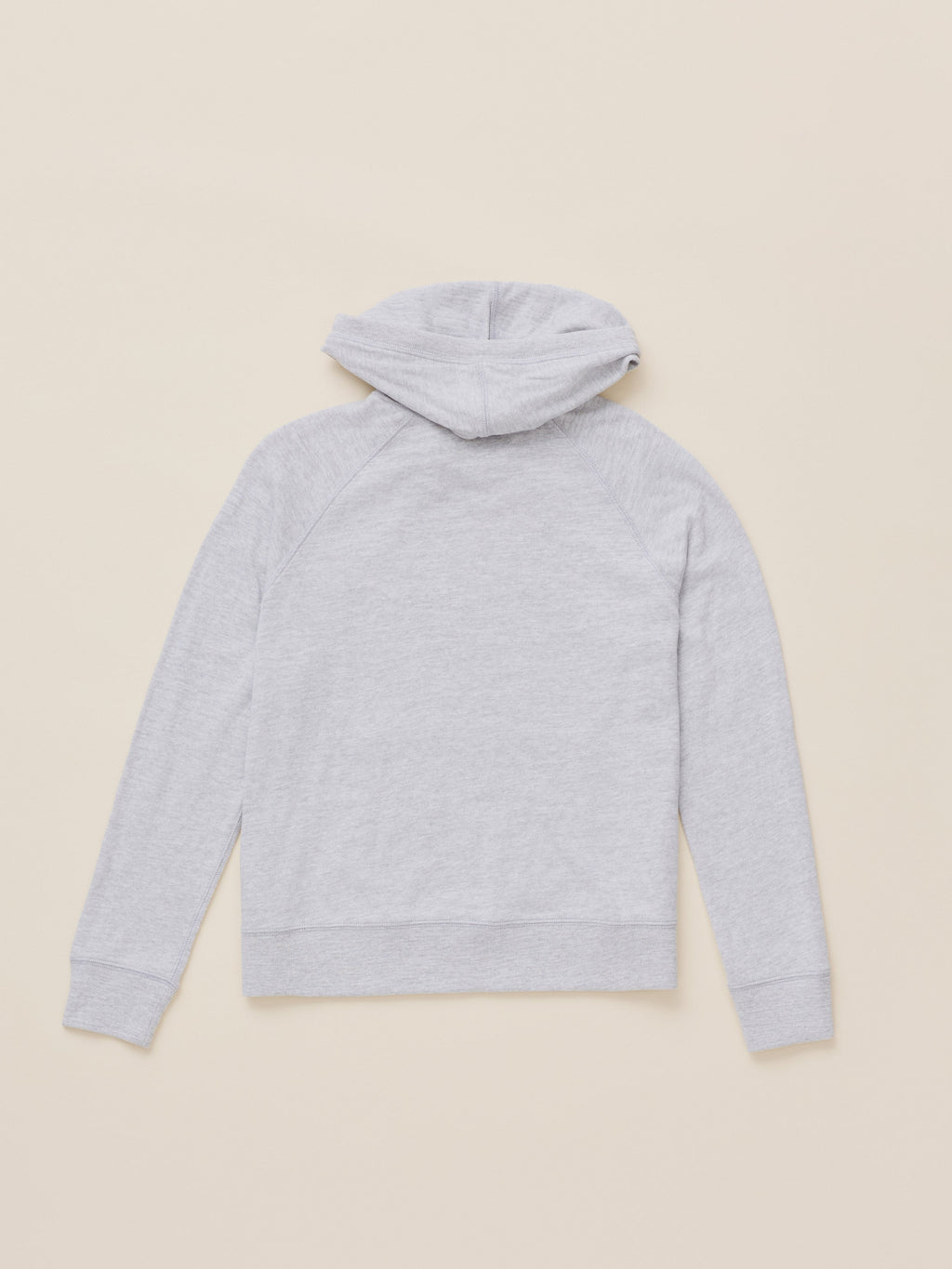 A light gray heathered hoodie shown from the back, laid flat on a solid beige background.